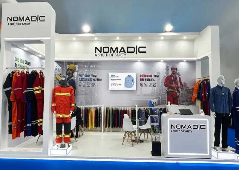 Nomadic booth front view at ADIPEC 2025 showcasing Certified IFR & FR Workwear for Oil & Gas